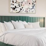 Elegant bedroom with modern decor and warm lighting.