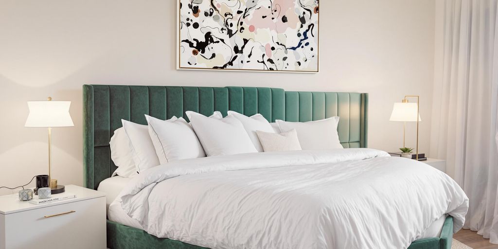 Elegant bedroom with modern decor and warm lighting.